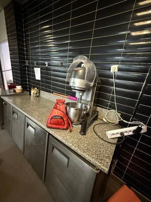 an image of a kitchen with a mixer on the counter