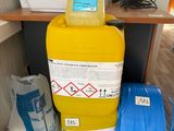 a yellow container with a blue handle next to a yellow container with a blue handle and a yellow container with a blue handle