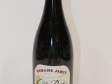 a bottle of wine that is sitting on a table