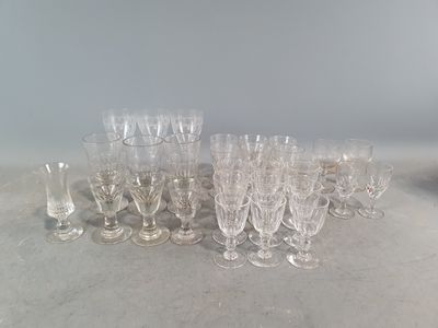 a lot of glasses that are sitting on the table