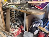 a workbench with tools on it in a garage