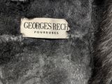 the back of a coat with a label on it that says george ' s reich