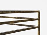 a close up of a metal bench with a wooden frame