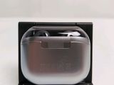 a black and silver case with a pair of earphones in it