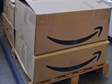 two boxes stacked on a pallet in a warehouse