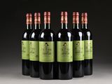 six bottles of red wine are lined up in a row