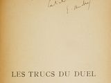 an old book with writing on it sitting on a table