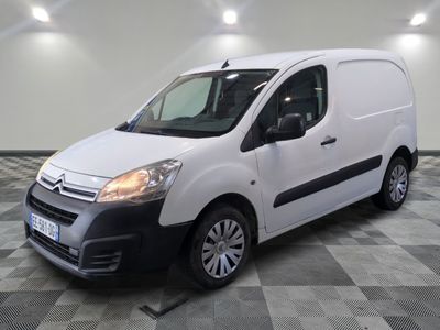 the white van is parked in a room with a checkered floor