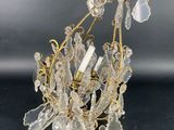 a close up of a chandelier on a table with a black background