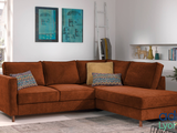 an image of a living room with a couch and ottoman