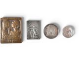 four different types of metal and wood stamps on a white surface