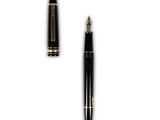 a pen and a ballpoint pen sitting next to each other