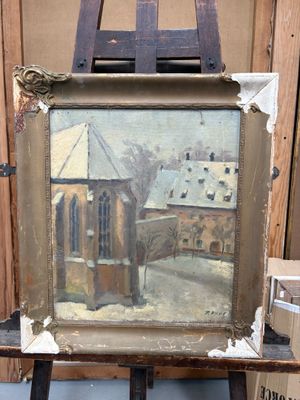 peinture sur chevalet devant un tableau représentant une église sous la neige