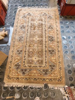 a rug on the floor in the middle of a room