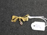 a tag with a bow on it next to a tag with a bow
