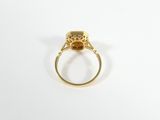 a close up of a gold ring with a stone in the middle