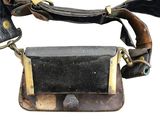 a black and brown bag with a leather strap