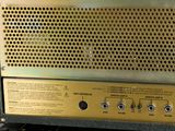 a close up of a gold and black amplifier