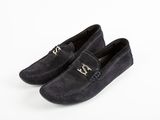 a pair of black sued shoes with a metal buckle on the front