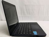 a black laptop with a blue sticker on the screen