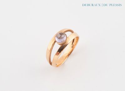 an image of a gold ring with a white diamond