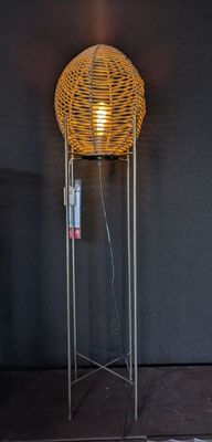 a lamp that is on a stand in a room