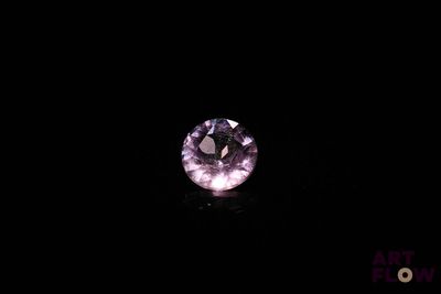 a purple diamond in the dark with a black background