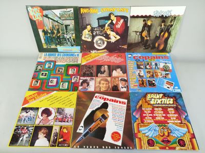 a lot of different album covers on the table
