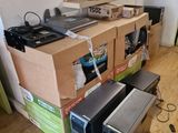 a lot of computers that are sitting on the floor