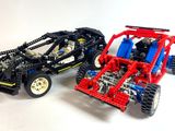 two lego cars sitting next to each other on a white surface