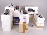 a lot of toy cars and boxes on the floor