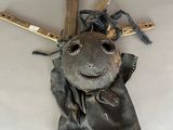 a picture of an old baseball glove and bat hanging on the wall