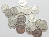 a lot of coins that are on the table