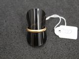 a ring that is on top of a black cup