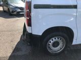 a white van that is parked in a parking lot