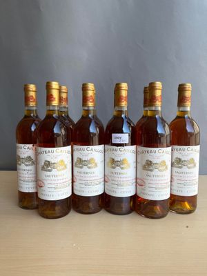 six bottles of wine are lined up on a table