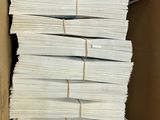 a lot of papers in a box on the table
