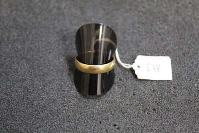 a ring that is sitting on a table with a price tag