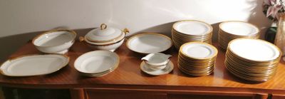 a lot of plates and cups on the table