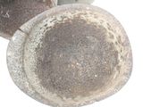two old pots sitting next to each other on a white surface