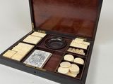 an old wooden box with a lot of items inside of it