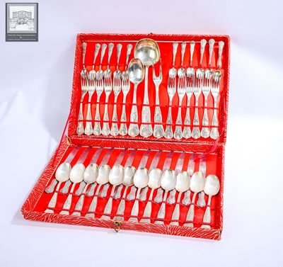 a red case with silverware in it on a white surface