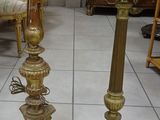 two candles that are sitting on the floor next to each other