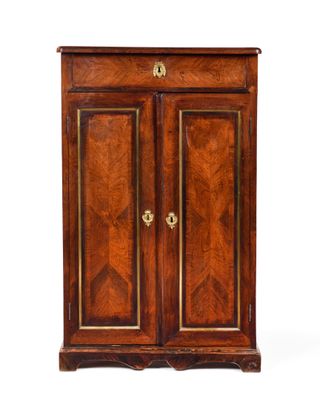 an antique wooden cabinet with two doors and two drawers