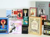 a lot of books that are sitting on a table