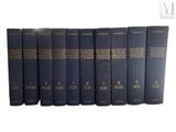 six books that are lined up in a row