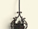 a small metal object hanging on the wall