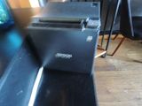 a laptop computer sitting on top of a black table