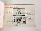 someone is holding a book that has a diagram of the electrical equipment inside of it