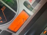 a vending machine that has a green light on it